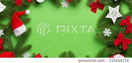 Christmas decorations and fir tree branch and gift boxon dark table. Top view frame with copy space Christmas decorations and fir tree branch and gift boxon dark table. Top view frame with copy space 119269278