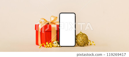 Digital phone mock up with rustic Christmas decorations for app presentation with empty space for you design. Christmas online shopping concept. Tablet with copy space on colored background Digital phone mock up with rustic Christmas decorations for app presentation with empty space for you design. Christmas online shopping concept. Tablet with copy space on colored background 119269417