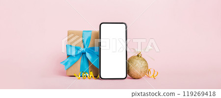 Digital phone mock up with rustic Christmas decorations for app presentation with empty space for you design. Christmas online shopping concept. Tablet with copy space on colored background 119269418