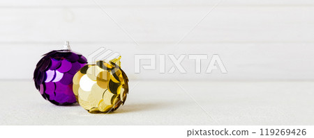 Christmas ball on colored background. decoration bauble with ribbon bow with copy space 119269426