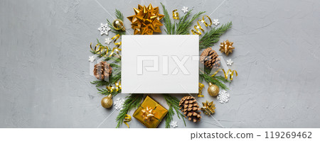 Flat lay Christmas composition. square Paper blank, pine tree branches, christmas decorations on Colored background. Top view, copy space for text Flat lay Christmas composition. square Paper blank, pine tree branches, christmas decorations on Colored background. Top view, copy space for text 119269462