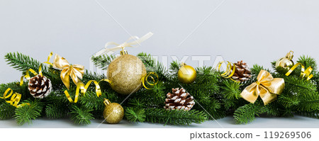 New Year Christmas tree toy, branches of a christmas tree, New Year decorations on a colored background 119269506