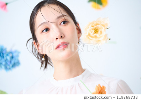 A woman surrounded by colorful flowers - fantasy A woman surrounded by colorful flowers - fantasy 119269738