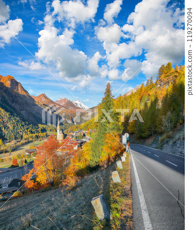Picturesque autumn landscape at Heiligenblut with St Vincent Church near Grossglockner mount . Picturesque autumn landscape at Heiligenblut with St Vincent Church near Grossglockner mount . 119270094