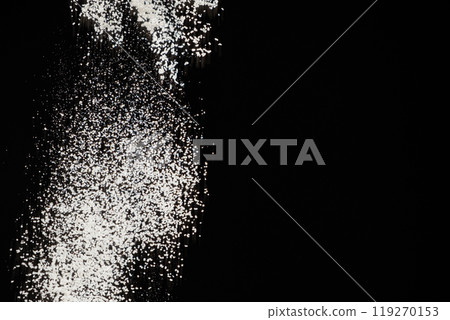 Abstract black and white background of pouring flour, space for text Abstract black and white background of pouring flour, space for text 119270153
