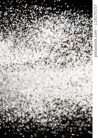 Abstract black and white background of pouring flour, space for text 119270157