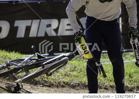 Athlete lifting a bike Athlete lifting a bike 119270657