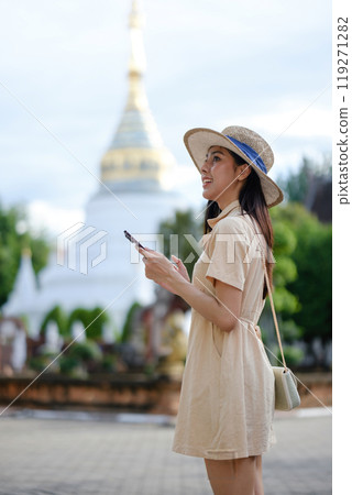 A woman wearing a straw hat A woman wearing a straw hat 119271282
