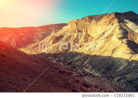 Mountainous desert in the morning. Judean desert in Israel at sunrise Mountainous desert in the morning. Judean desert in Israel at sunrise 119272061