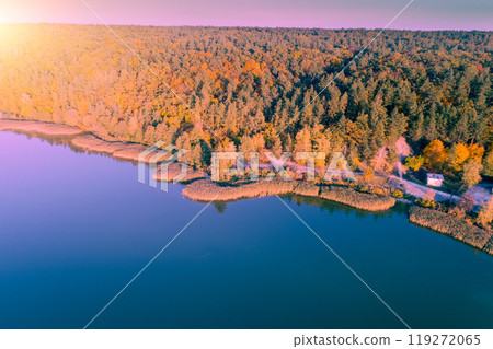 Lake in the autumn in the early morning. View of lakeshore with colorful trees. Aerial view Lake in the autumn in the early morning. View of lakeshore with colorful trees. Aerial view 119272065