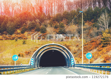 Entrance to the tunnel on a mountain road. Driving a car on a mountain road 119272178