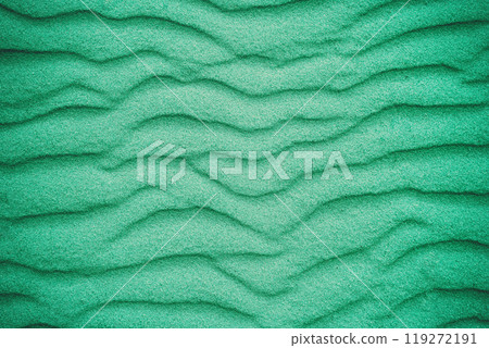 Abstract wavy sandy background. Texture of sand in the desert or on the beach. Green color toning 119272191