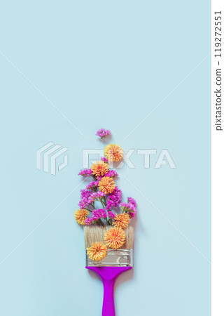 Autumn creative concept of yellow and pink autumn flowers and paint brush on blue background. Fashion minimal art. View from above. Autumn creative concept of yellow and pink autumn flowers and paint brush on blue background. Fashion minimal art. View from above. 119272551
