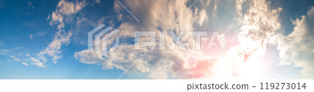 Cloudy sky at sunset. Cloudy sky background. Horizontal banner 119273014