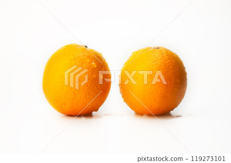 Two oranges are sitting on a white background Two oranges are sitting on a white background 119273101