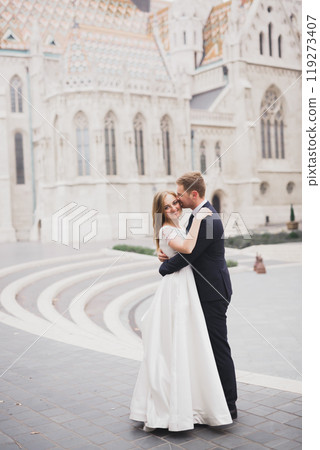 Wedding couple holding hands, groom and bride together on wedding day 119273407