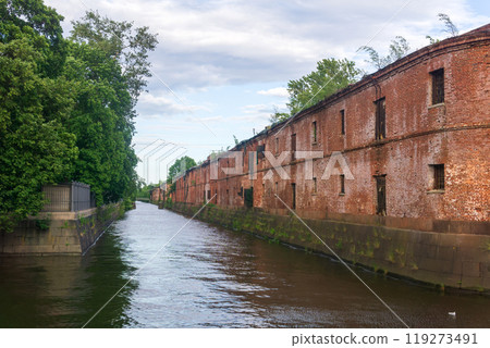 Obvodny Canal in Kronstadt, view of old drainage canal with an abandoned warehouse building on the bank Obvodny Canal in Kronstadt, view of old drainage canal with an abandoned warehouse building on the bank 119273491