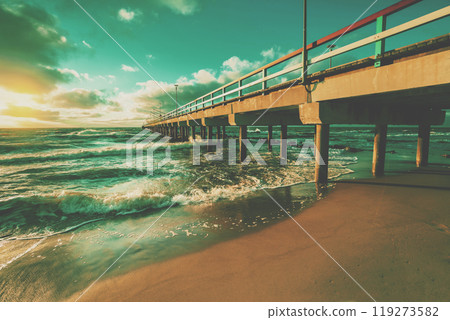 Seascape in the evening. Pier and sea at sunset Seascape in the evening. Pier and sea at sunset 119273582