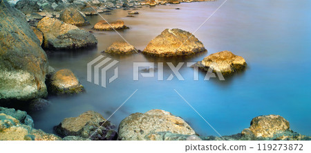 Seascape with stones in the water nature background. Long exposure 119273872