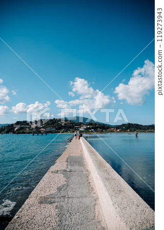 A long, narrow walkway is leading to the water 119273943