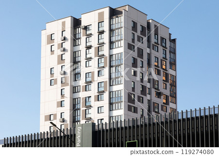 Modern high-rise apartment buildings in a residential area showcasing urban living and availability 119274080