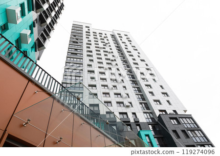 Modern high-rise apartment buildings in a residential area with varied architectural designs and 119274096