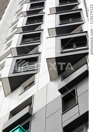 High-rise apartment buildings in a residential area showcasing modern architecture and rental 119274123