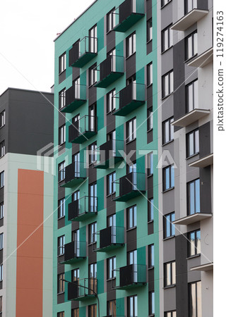Modern high-rise apartments with balconies in a vibrant residential area focused on urban living and Modern high-rise apartments with balconies in a vibrant residential area focused on urban living and 119274163