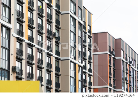 Modern high-rise apartment buildings in a residential area with views of neighboring units and urban 119274164