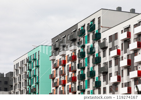 Modern high-rise residential buildings showcasing contemporary architecture in a bustling urban area Modern high-rise residential buildings showcasing contemporary architecture in a bustling urban area 119274167