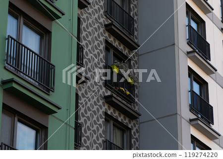 High-rise apartment buildings in a residential area showcasing modern architecture and balcony High-rise apartment buildings in a residential area showcasing modern architecture and balcony 119274220