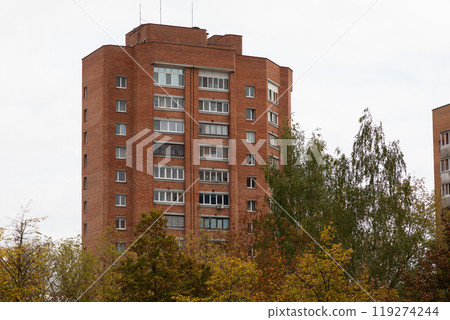 Residential high-rise buildings in a city neighborhood with vibrant autumn foliage and a focus on Residential high-rise buildings in a city neighborhood with vibrant autumn foliage and a focus on 119274244
