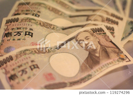 Fukuoka-shi, Fukuoka-Ken, Hakata-ku, Japan - October 13, 2024: Japan's banknotes will undergo a currency reform with a new design. 100,000 yen paper note, currency 119274296