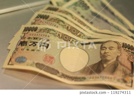Fukuoka-shi, Fukuoka-Ken, Hakata-ku, Japan - October 13, 2024: Japan's banknotes will undergo a currency reform with a new design. 100,000 yen paper note, currency Fukuoka-shi, Fukuoka-Ken, Hakata-ku, Japan - October 13, 2024: Japan's banknotes will undergo a currency reform with a new design. 100,000 yen paper note, currency 119274311