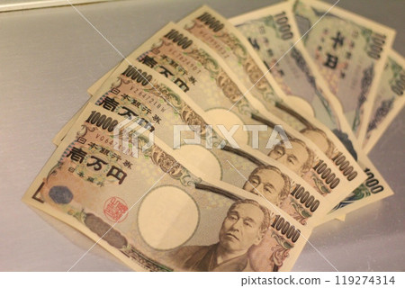 Fukuoka-shi, Fukuoka-Ken, Hakata-ku, Japan - October 13, 2024: Japan's banknotes will undergo a currency reform with a new design. 100,000 yen paper note, currency Fukuoka-shi, Fukuoka-Ken, Hakata-ku, Japan - October 13, 2024: Japan's banknotes will undergo a currency reform with a new design. 100,000 yen paper note, currency 119274314