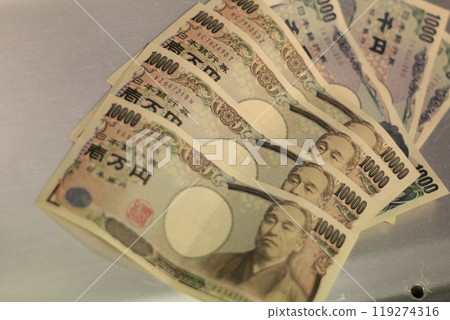 Fukuoka-shi, Fukuoka-Ken, Hakata-ku, Japan - October 13, 2024: Japan's banknotes will undergo a currency reform with a new design. 100,000 yen paper note, currency Fukuoka-shi, Fukuoka-Ken, Hakata-ku, Japan - October 13, 2024: Japan's banknotes will undergo a currency reform with a new design. 100,000 yen paper note, currency 119274316