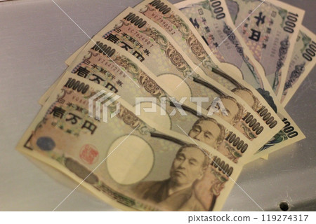 Fukuoka-shi, Fukuoka-Ken, Hakata-ku, Japan - October 13, 2024: Japan's banknotes will undergo a currency reform with a new design. 100,000 yen paper note, currency 119274317