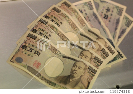 Fukuoka-shi, Fukuoka-Ken, Hakata-ku, Japan - October 13, 2024: Japan's banknotes will undergo a currency reform with a new design. 100,000 yen paper note, currency 119274318