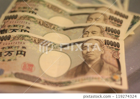 Fukuoka-shi, Fukuoka-Ken, Hakata-ku, Japan - October 13, 2024: Japan's banknotes will undergo a currency reform with a new design. 100,000 yen paper note, currency Fukuoka-shi, Fukuoka-Ken, Hakata-ku, Japan - October 13, 2024: Japan's banknotes will undergo a currency reform with a new design. 100,000 yen paper note, currency 119274324