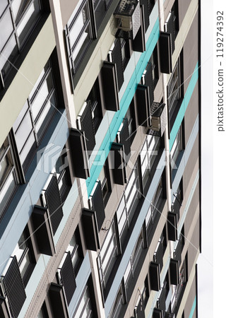 High-rise apartment buildings in a vibrant residential area showcasing modern architecture and air 119274392