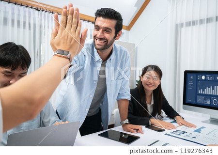 Analyst team leader celebrate with colleague after successful meeting. Prudent Analyst team leader celebrate with colleague after successful meeting. Prudent 119276343