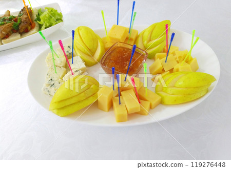 plate of sliced apples and cheese for breakfast 119276448
