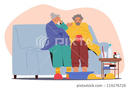 Elderly Couple Sits On A Couch, Feeling Unwell. Both Are Wrapped In Blankets. Woman Holds Her Head Elderly Couple Sits On A Couch, Feeling Unwell. Both Are Wrapped In Blankets. Woman Holds Her Head 119276726