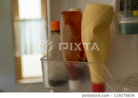 Mayonnaise and ketchup in the refrigerator door pocket Mayonnaise and ketchup in the refrigerator door pocket 119278636
