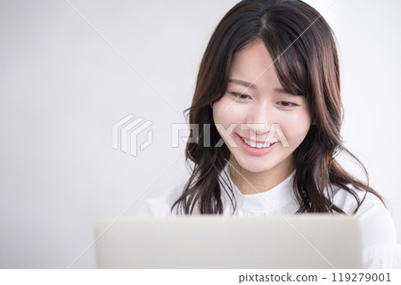 Close-up of a working young woman looking at a computer Close-up of a working young woman looking at a computer 119279001