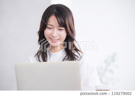 Close-up of a working young woman looking at a computer Close-up of a working young woman looking at a computer 119279002