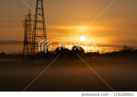 The morning sun and a steel tower on a hazy morning The morning sun and a steel tower on a hazy morning 119280002