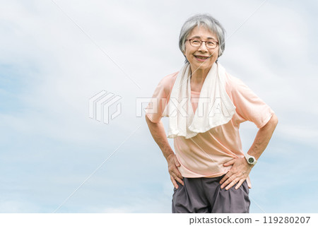 Senior woman in sportswear smiling with empty background 119280207