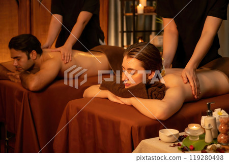 Caucasian couple customer enjoying relaxing anti-stress massage. Quiescent Caucasian couple customer enjoying relaxing anti-stress massage. Quiescent 119280498