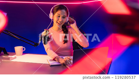 Smiling creative young beautiful Asian influencer talking in channel. Stratagem. 119280537